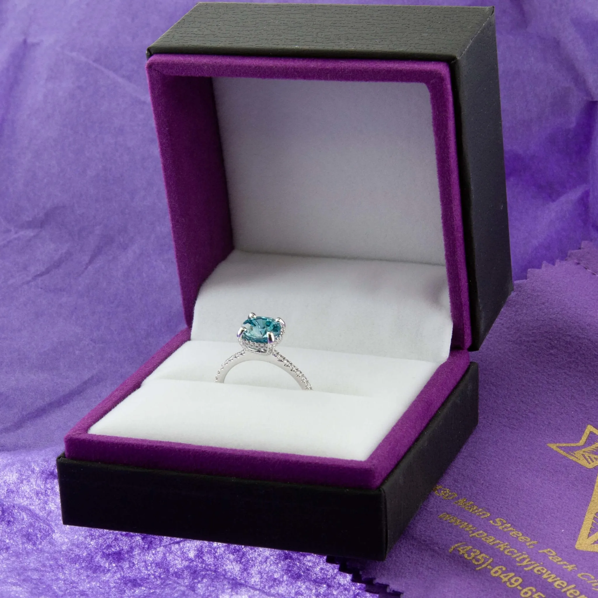 Blue Zircon Modern Halo and Diamond Accented Ring